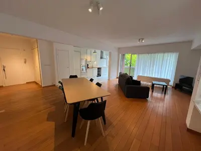 a living room with a table and a couch at Alexis's loft 2 in Liège