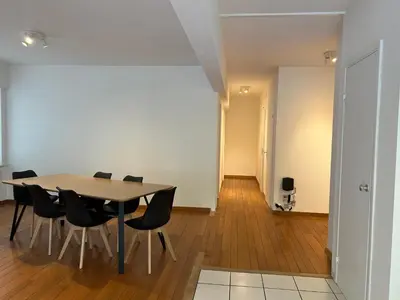 a dining room with a table and chairs at Alexis's loft 2 in Liège