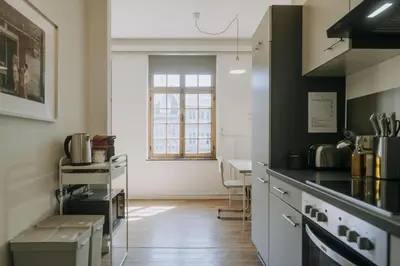a kitchen with a stove and a counter top at 1 bedroom apartment in Liège center, Place du Marche - 3rd floor in Liège