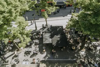 an overhead view of a park with people and trees at 1 bedroom apartment in Liège center, Place du Marche - 3rd floor in Liège