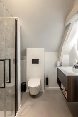 a bathroom with a toilet and a sink at Borgraaf - Fruitzicht in Borgloon