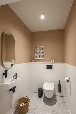 a bathroom with a toilet and a sink at Borgraaf - Palazzio in Borgloon