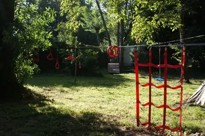 a yard with red ribbons hanging from a rope at Bizette67 in Herstal