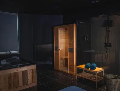 a kitchen with a sink and a stand up shower at Loft Ardent in Liège