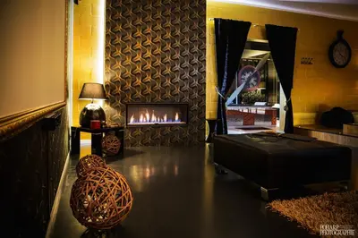 a living room with a couch and a fireplace at Le Gate One in Herbesthal