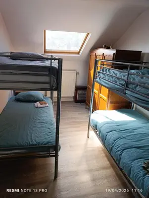 a room with two bunk beds and a window at résidence KAKIKA in Verviers