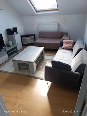 a living room with a couch and a coffee table at résidence KAKIKA in Verviers
