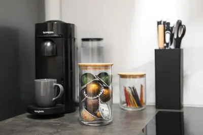 a coffee maker and two cups on a counter at Cozy Home Liege in Liège
