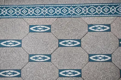 a tile floor with blue and white tiles at Cozy Home Liege in Liège