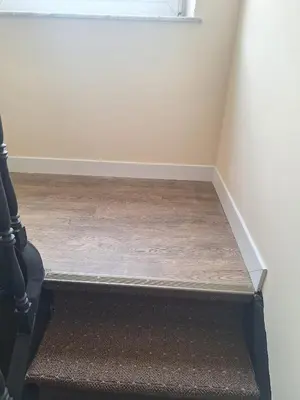 a stairwell with a wooden floor in a room at Tc home in Liège