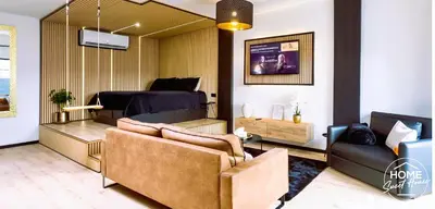 a living room with a couch and a bed at Luxury Loft Home Sweet House in Oupeye