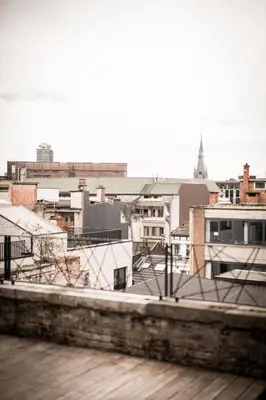 a view of a city from the roof of a building at La Tour in Liège