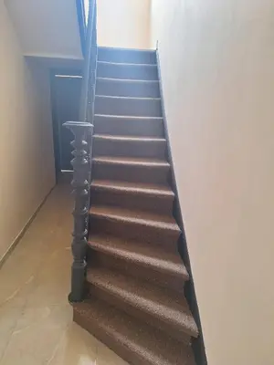 a set of stairs in a room at Maison sympathique in Liège