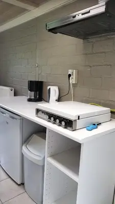 a kitchen with a counter with a appliance on it at Bungalow in Sonnevijver - Hoge kempen in Lanaken
