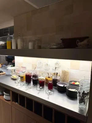 a kitchen with glasses of food on a counter at Door9 Hasselt - Digital Hotel & Restaurant in Hasselt