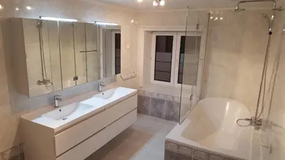 a bathroom with two sinks and a shower and a tub at Vakantiewoningen De Jud in Maasmechelen