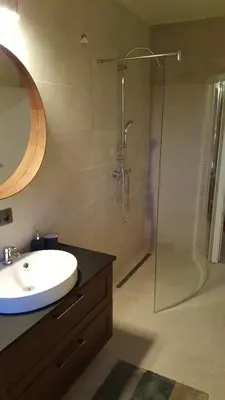 a bathroom with a sink and a shower at Casa Loon in Borgloon