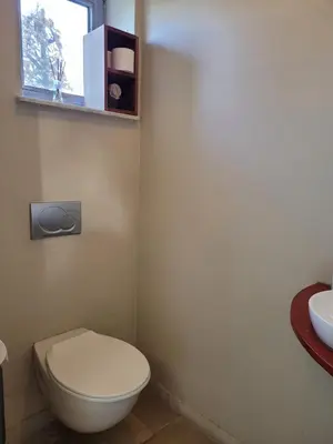 a bathroom with a white toilet and a sink at Casa Loon in Borgloon