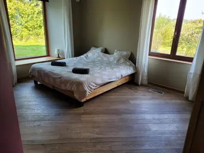 a bed in a room with two pillows on it at Casa Loon in Borgloon