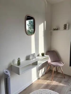 a white room with a desk and a chair at Home Terboekt in Genk