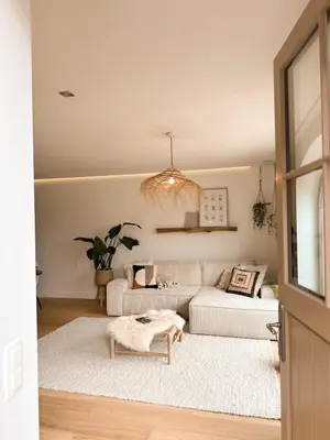 a living room with a white couch and a table at Ibiza LOFT MOLN in Kinrooi