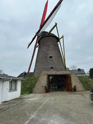 a building with a windmill on top of it at Ibiza LOFT MOLN in Kinrooi