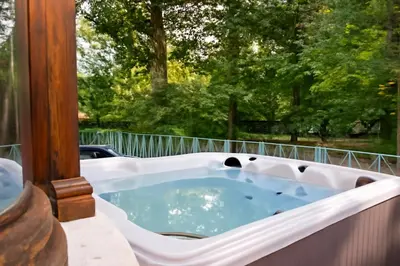 a jacuzzi tub on the back of a house at 12P 6B Renovated villa with jacuzzi at Genk in Genk