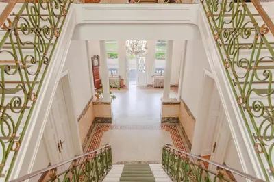 an ornate staircase in a home with a stair case at 12P 6B Renovated villa with jacuzzi at Genk in Genk