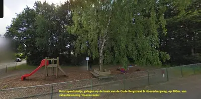 a park with a playground with a slide and trees at Charming Belgian Getaway, vakantiewoning in Oudsbergen - 3 Bedrooms Garden in Oudsbergen