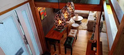 an overhead view of a dining room table with an umbrella at Tiny House Dreiländereck in Neu-Moresnet