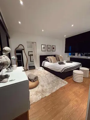 a bedroom with a bed and a living room at Felicita in Jalhay