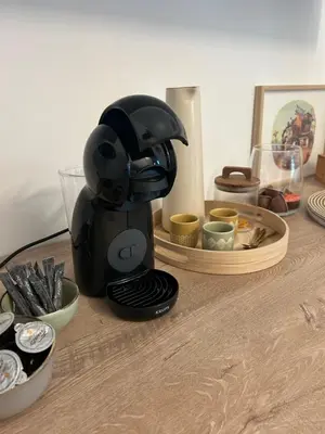 a coffee maker sitting on top of a wooden table at Felicita in Jalhay