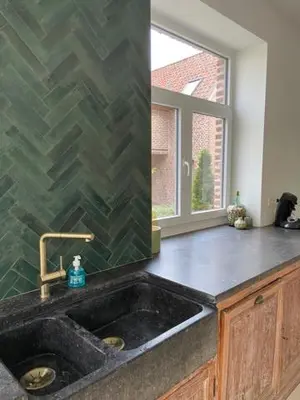 a kitchen counter with a sink and a window at Cièlo in Tongeren