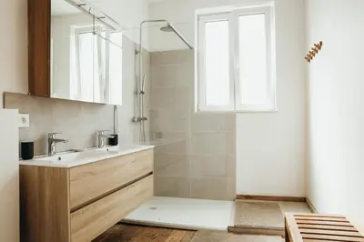 a bathroom with a sink and a shower at Simonis, Parc de la Boverie by WelcHome in Liège