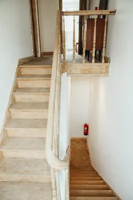 a staircase in a house with wooden floors at Simonis, Parc de la Boverie by WelcHome in Liège