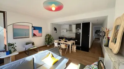 a living room with a couch and a table at 102 Cozy Neuvice in Liège