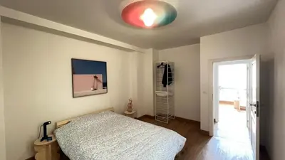 a bedroom with a bed and a red light on the ceiling at 301 Loft Chic Central in Liège