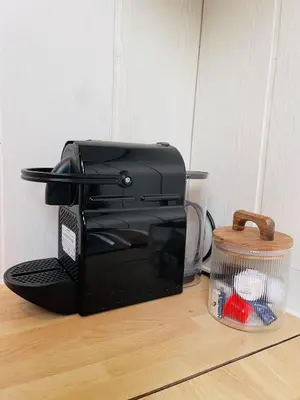 a black toaster sitting on top of a counter at Appartement rustique à Liège in Liège