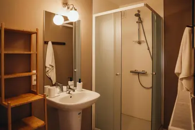 a bathroom with a sink and a shower at Liège Centre-ville by WelcHome in Liège