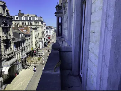 a view of a city street from a building at Liège Carré by WelcHome in Liège