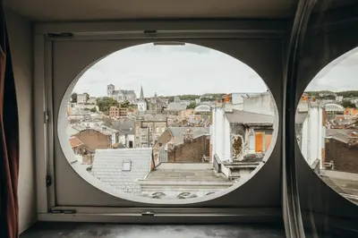 a view of a city from a window at Liège Carré by WelcHome in Liège