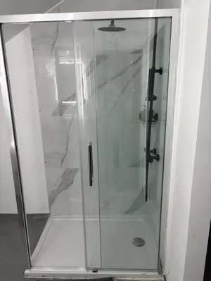 a shower with a glass door in a bathroom at La suite 7 Sauna et jacuzi in Seraing