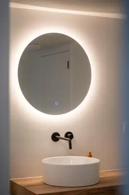 a bathroom with a white sink and a mirror at Villa Weidezicht in Heusden - Zolder