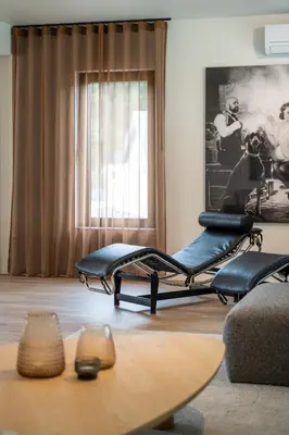 a living room with a couch and a table at Villa Weidezicht in Heusden - Zolder