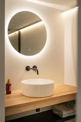 a bathroom with a white sink and a mirror at Villa Weidezicht in Heusden - Zolder