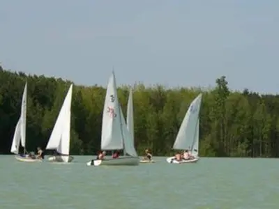 a group of small sailboats on a lake at Farm Stay with Sauna, Teuven in Teuven