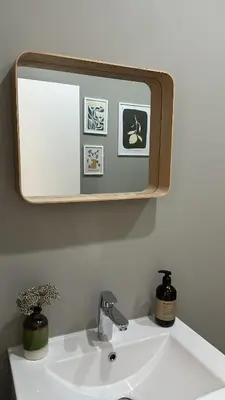 a bathroom sink with a mirror above it at Superbe appartement 2 chambres en centre-ville in Liège