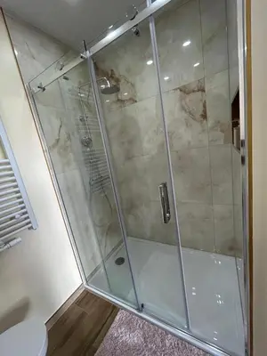 a shower with a glass door in a bathroom at Appartement romantique de luxe à Liège Chambre, salon SDB privée 2e étage in Liège