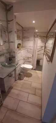 a bathroom with a toilet and a sink at Gîte 