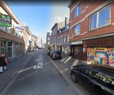 a city street with cars parked on the side of the road at Chambre de luxe Afrik a Liège Grande Sale de bain privée check in autonome cuisine partagée in Liège